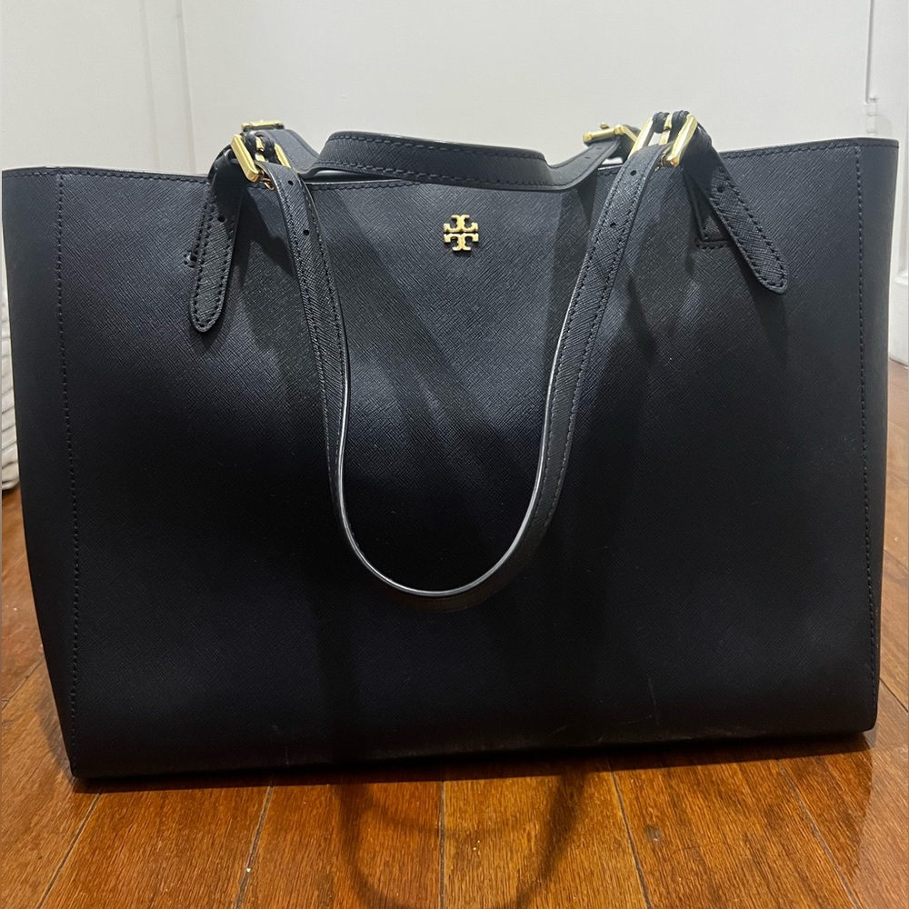 Dark blue Tory Burch tote. Some scratches at the bottom as seen in pictures